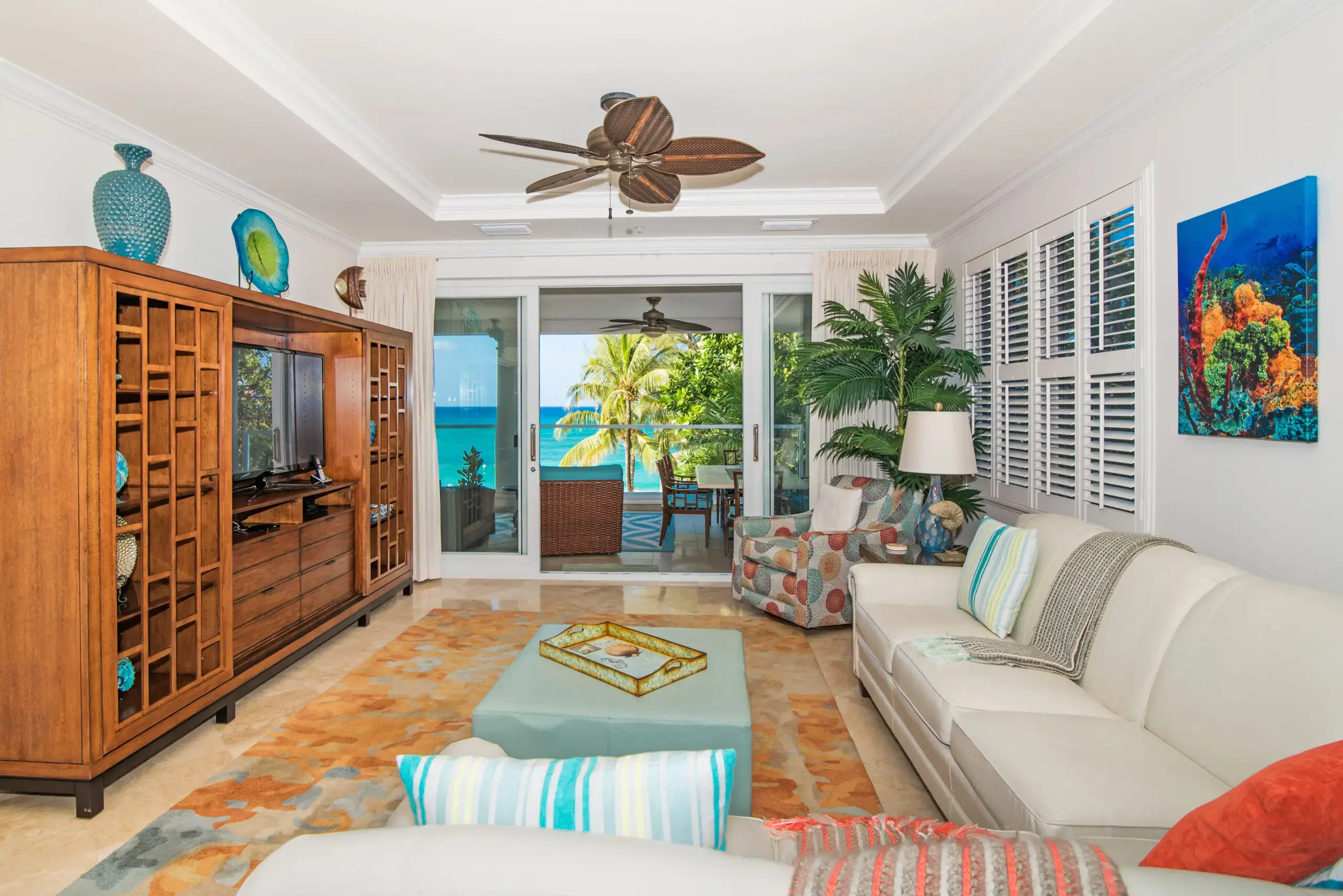 Sea Breeze condo living room with ocean view through sliding doors